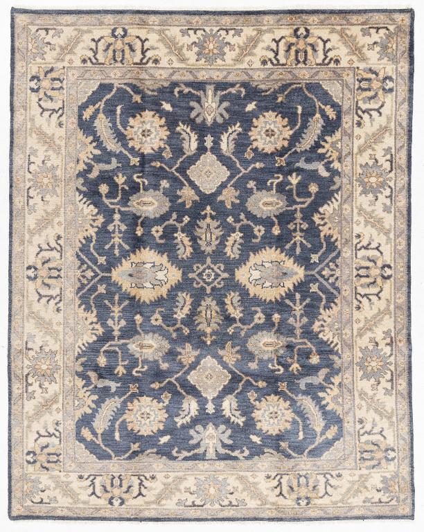 An Agra carpet, c. 305 x 245 cm.