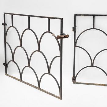 A pair of cast iron gates, 1930's.