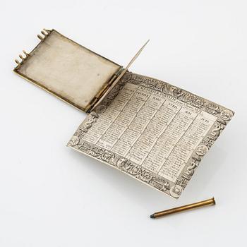 A gilt metal and mother-of-pearl pocket calendar, early 20th Century.