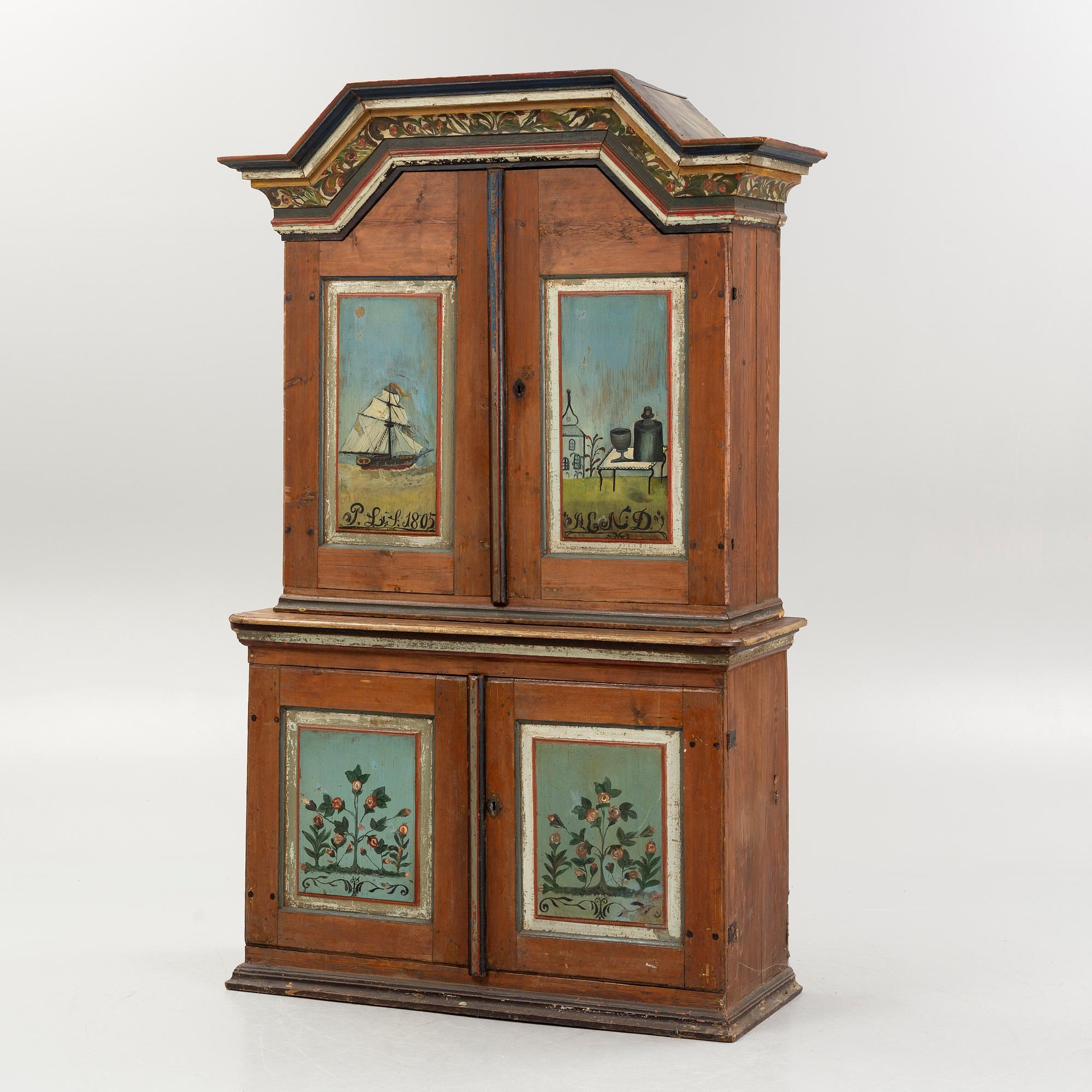 A Swedish polychrome.-painted cabinet, presumably from Halland, dated 1805.