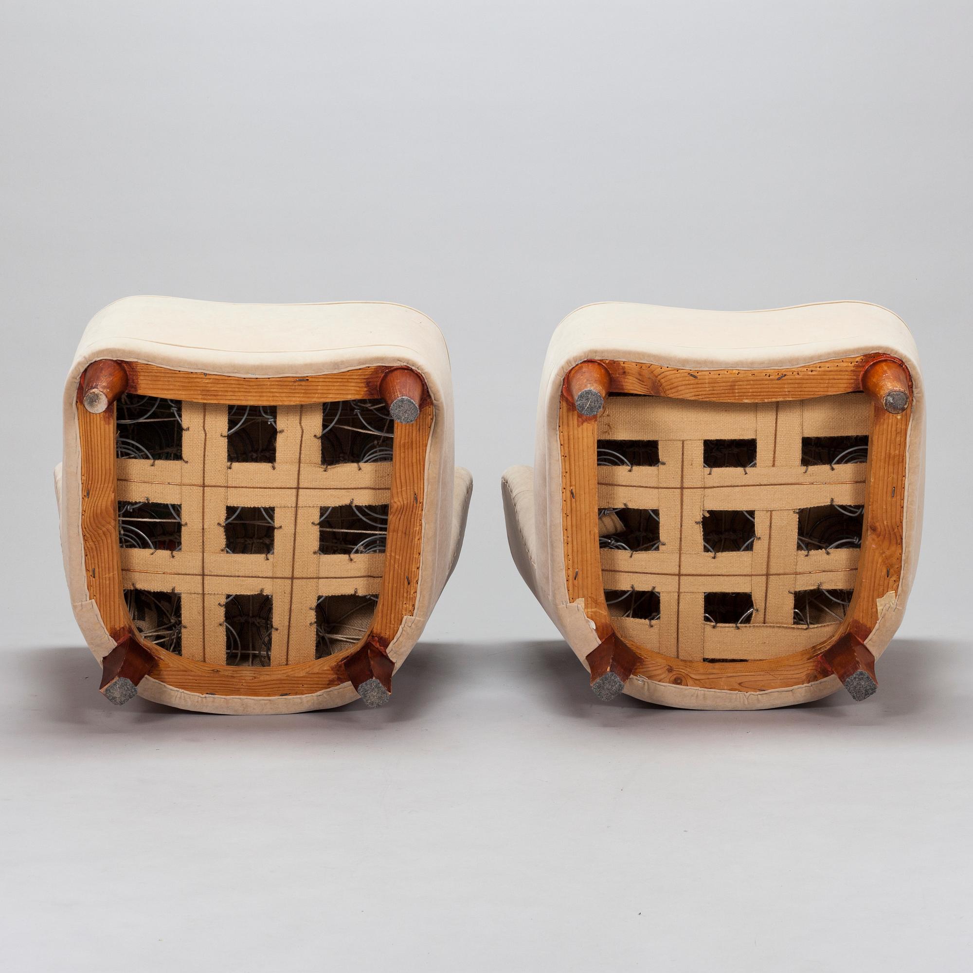 A pair of mid-20th century armchairs.