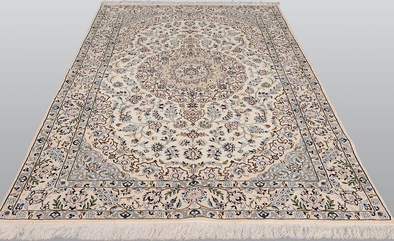 A Nain part silk carpet, 254 x 156 cm.