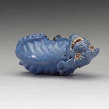 A blue glazed figure of a buddhist lion, Qing dynasty, Qianlong (1736-95).