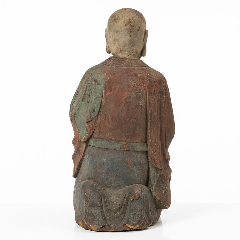 A Chinese sculpture of a louhan, 20th century.