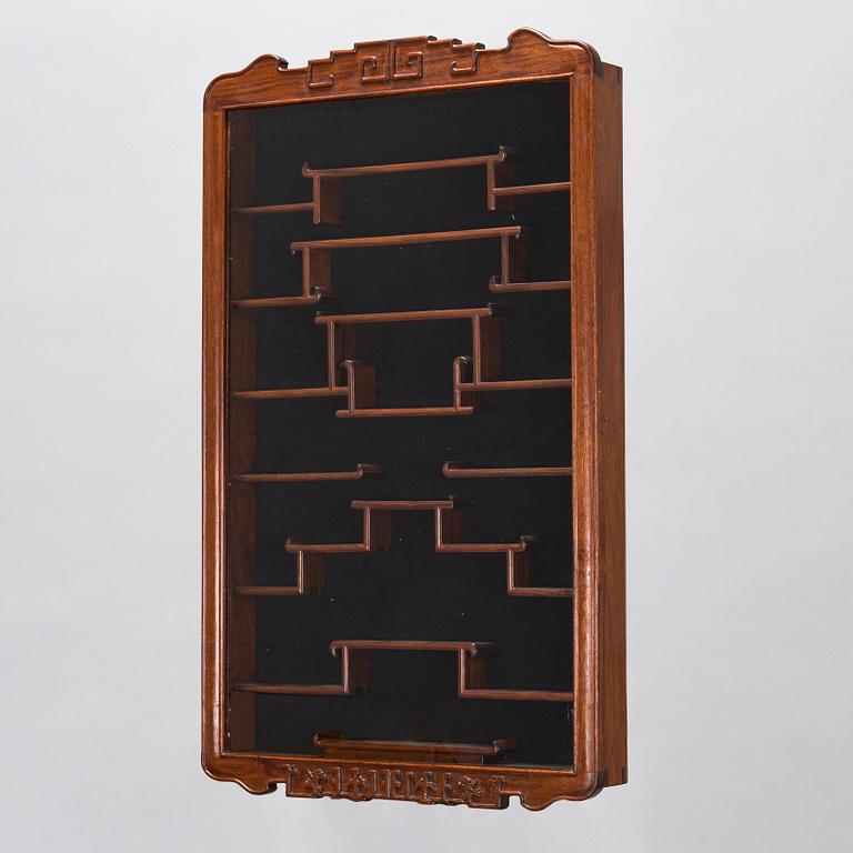 A Chinese 20th century hardwood wall cabinet.