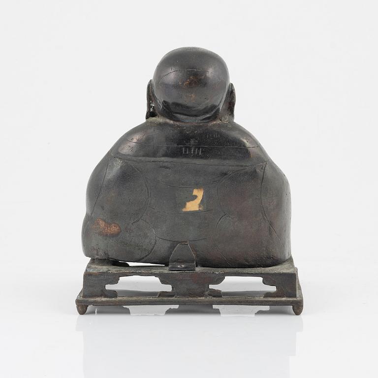 A bronze figure of Buddai, Qing dynasty (1664-1912).