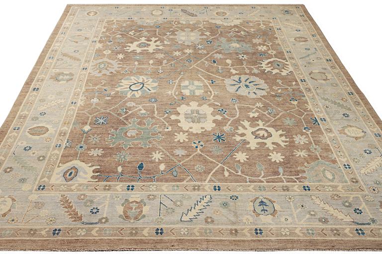 An Ushak design carpet, a. 423 x 305 cm.