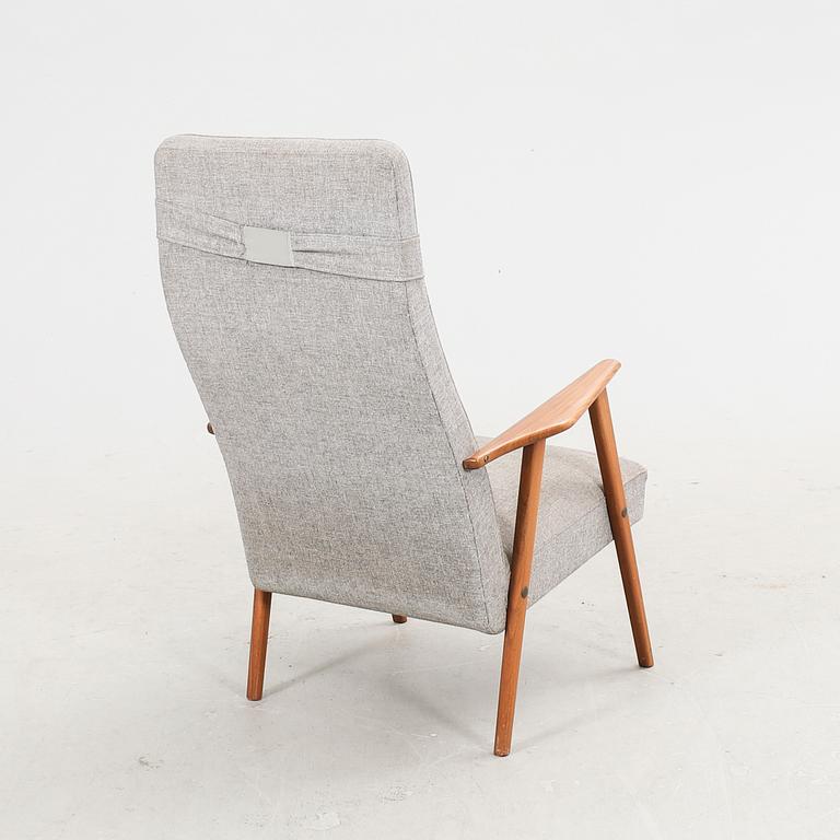 A 1960s teak armchair.