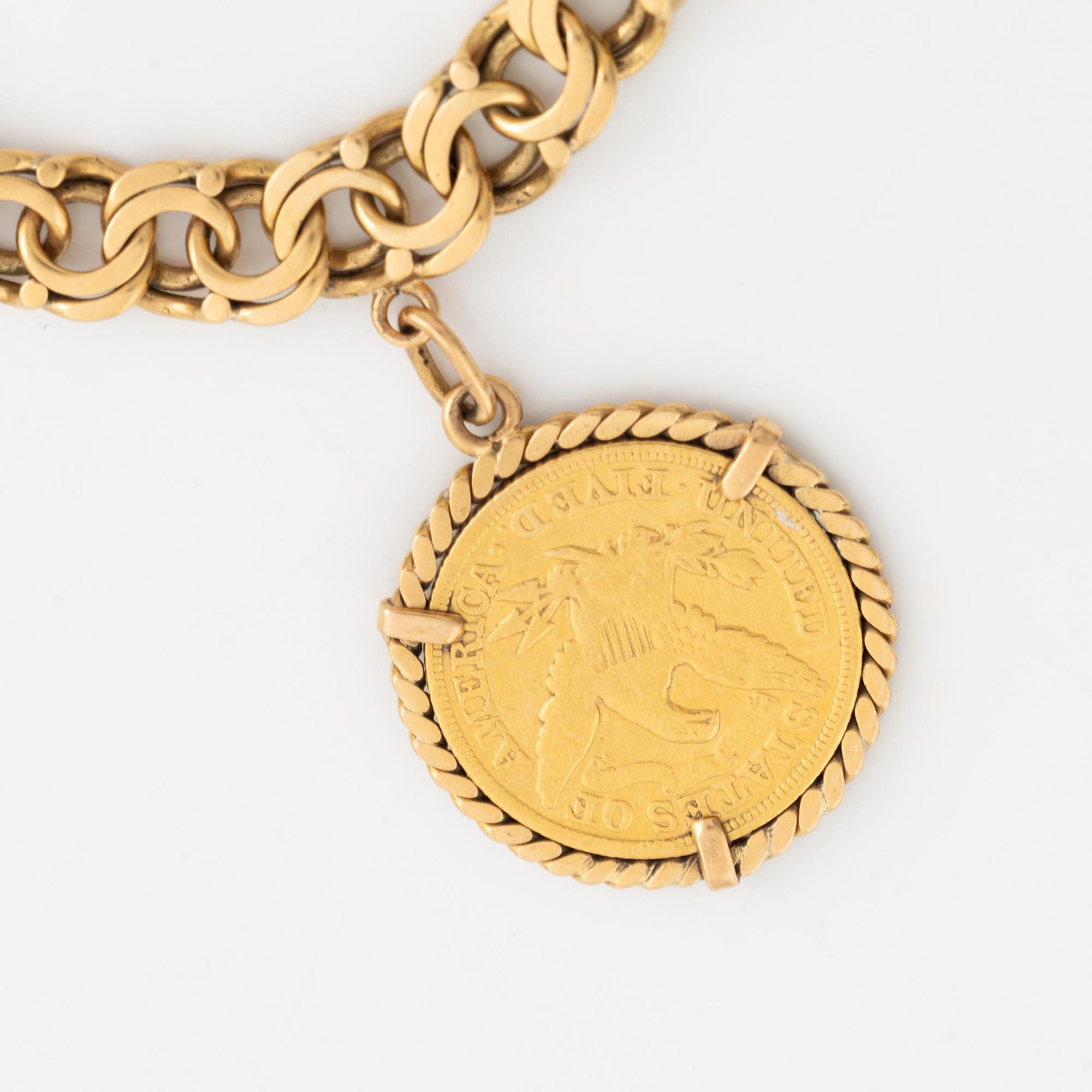 Armband guld bismarcklänk med berlocker med guldmynt.
