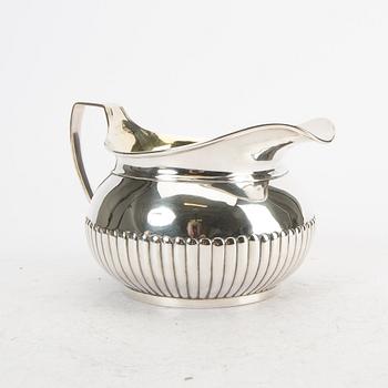 A 19th century English silver milk pitcher mark of John Eames Lodnon 1808 weight 340 grams.