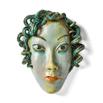 95. Allan Ebeling, a glazed earthenware wall sculpture of a masque, Torshälla 1934.
