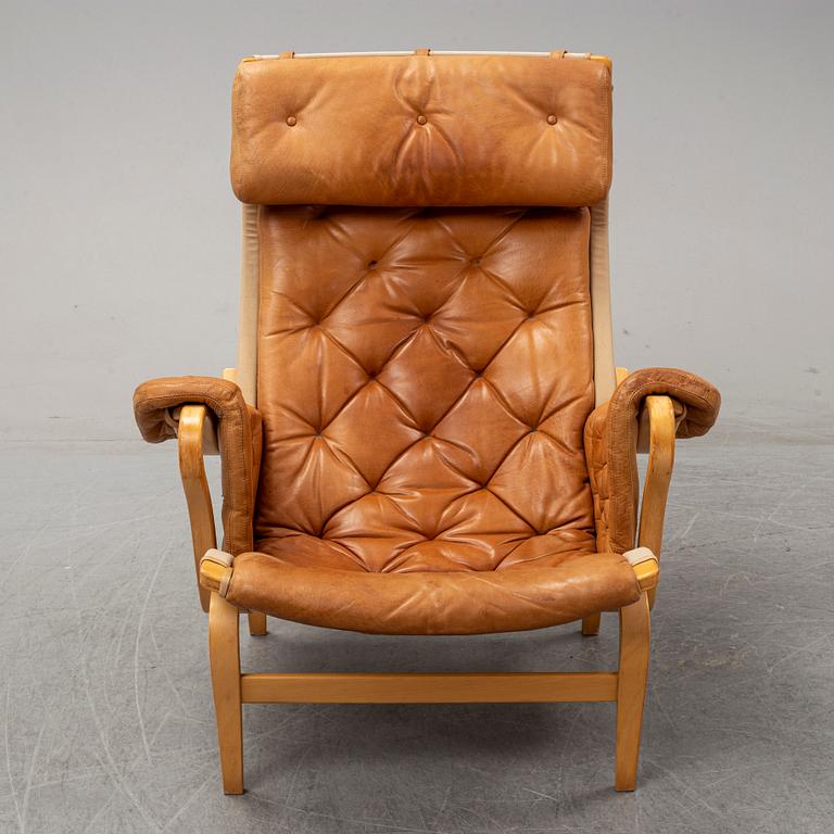 Bruno Mathsson, a "Pernilla" lounge chair with ottoman, DUX, Sweden, late 1900's.