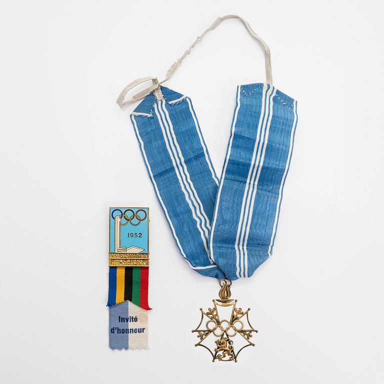 The Finnish olympic cross, 1st class, silver and enamel. Tillander, Helsinki and a Guest of Honor pin.