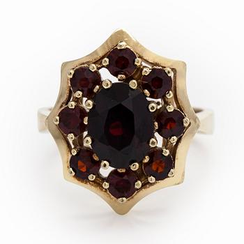 An 8K gold ring with garnets.