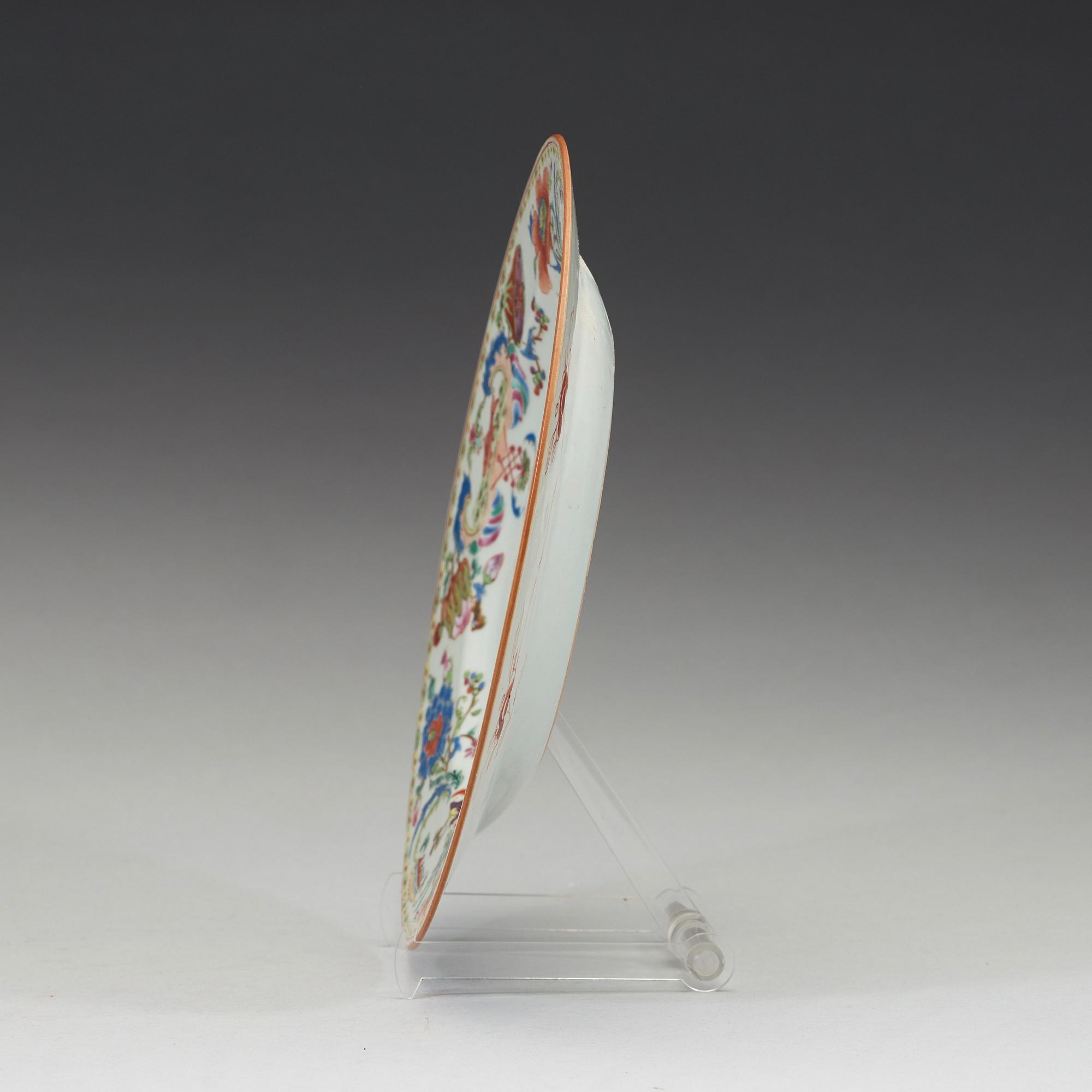 An export porcelain 'Pompadour' armorial plate, Qing Dynasty, circa 1745.