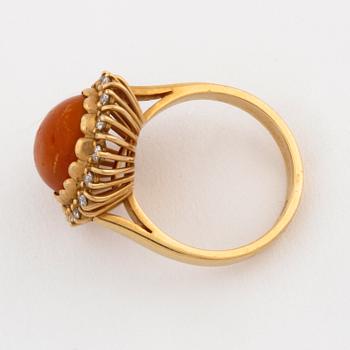 A amber and brilliant cut diamond ring by Walters guldsmedja, Stockholm, 1991.