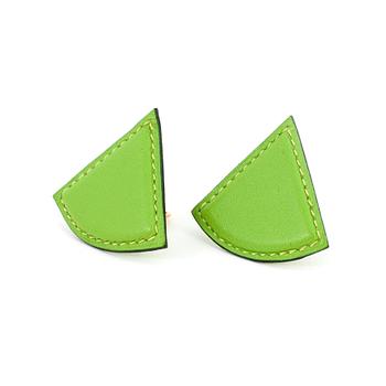 HERMÈS, a pair of green leather clip earings from the 1990s.