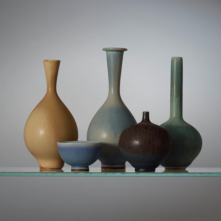A Berndt Friberg set of 24 miniature stoneware vases and bowls in a teak casket, Gustavsberg Studio.