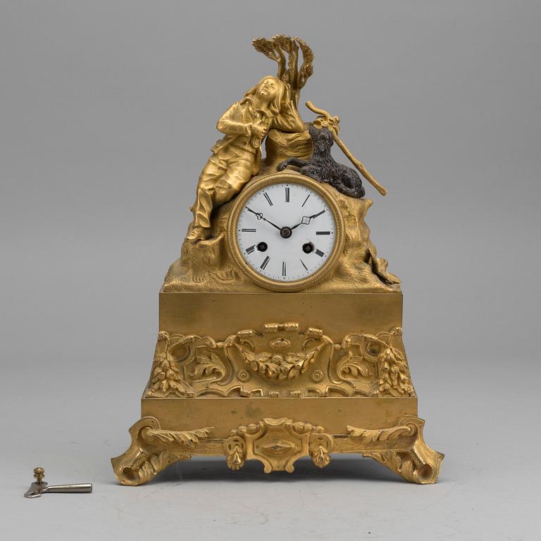 A EMPIRE GILT-BRONZE MANTEL CLOCK.