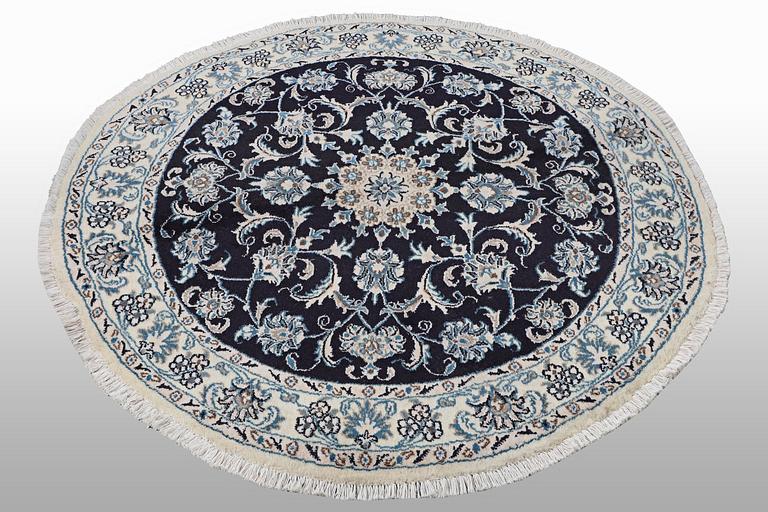 A rug, Nain, part silk, diameter ca. 140 cm.