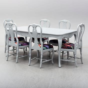 A rococo style dining table and six chairs, end of 20th century.