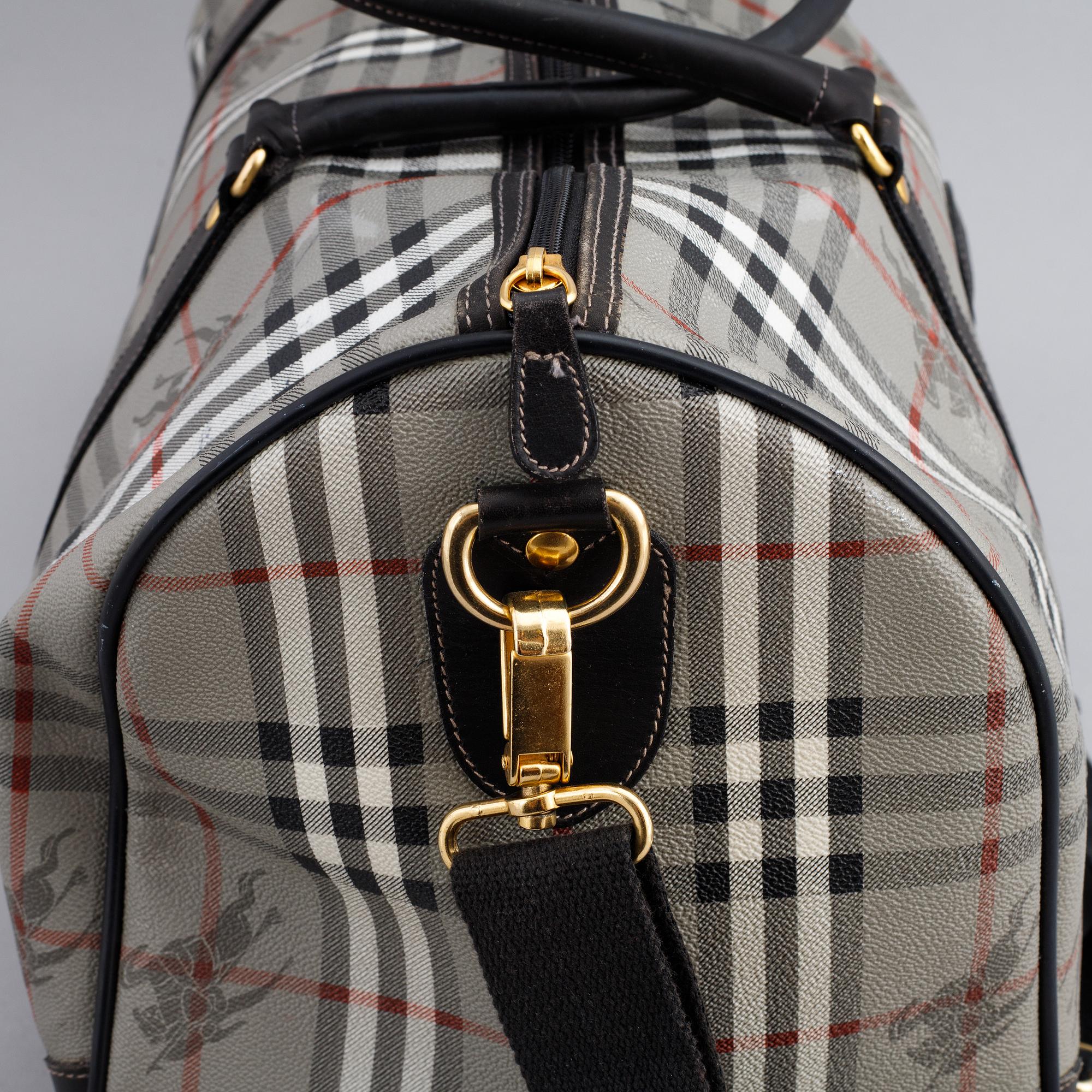 Burberry, a canvas weekend bag.