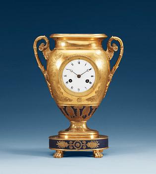1225. An Empire gilt porcelain table clock, presumably Russian.