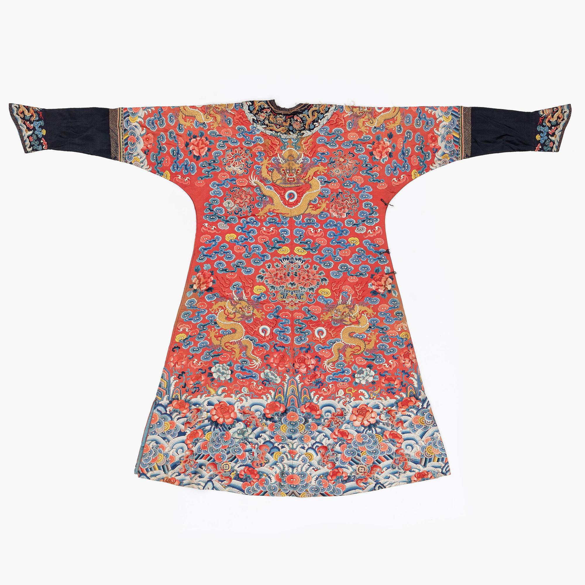 An embroidered red ground five clawed dragon 'female' formal robe, Qing dynasty, 19th century.