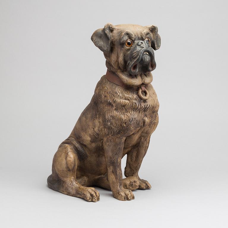 A 20th CENTURY TERRACOTTA DOG.