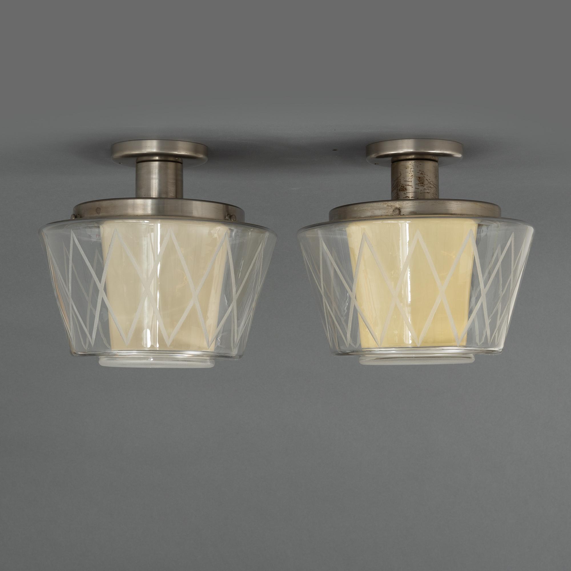 Harald Notini, taklampor, ett par, modell "11197", Arvid Böhlmarks Lampfabrik, Stockholm, 1940-50-tal.