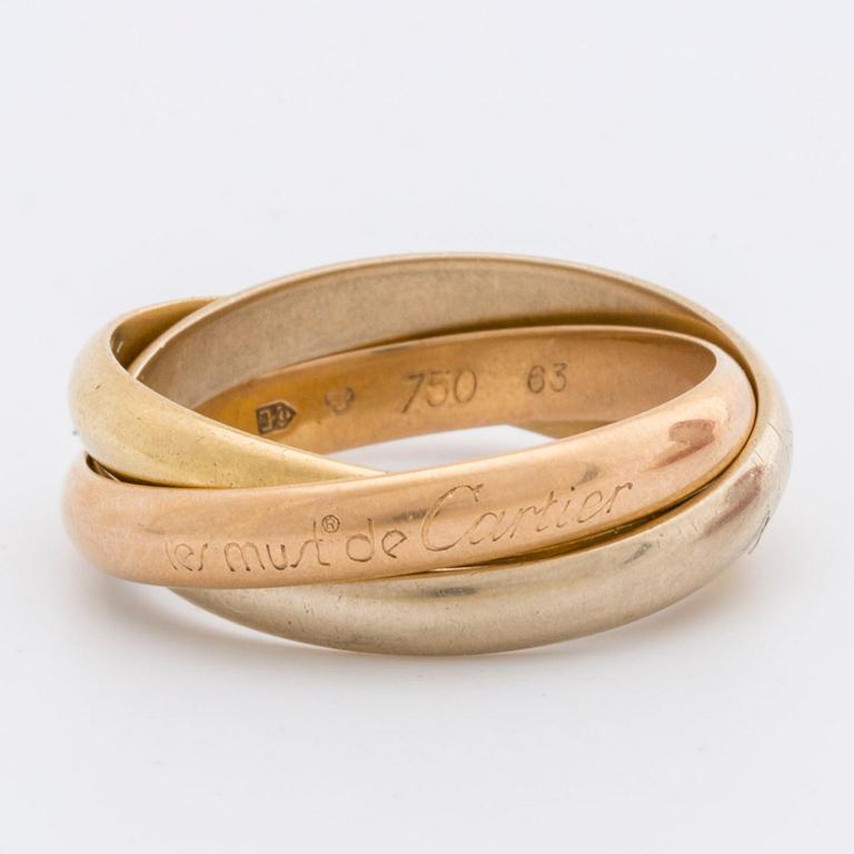RING "Trinity" Must de Cartier, tri-coloured 18k gold, original case and certifikat.
