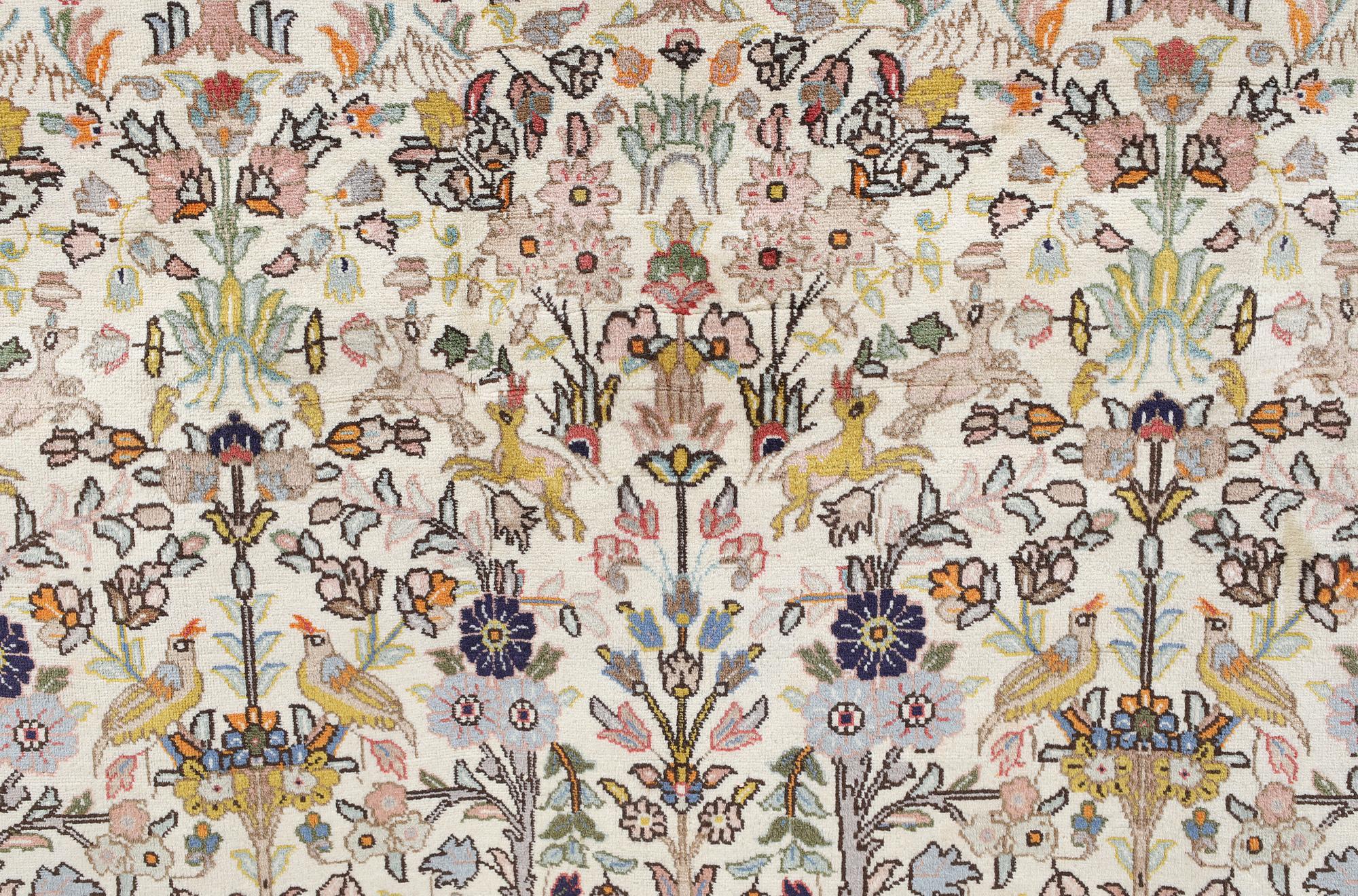 A Täbriz Tabatabai carpet, c.  352 x 240 cm.