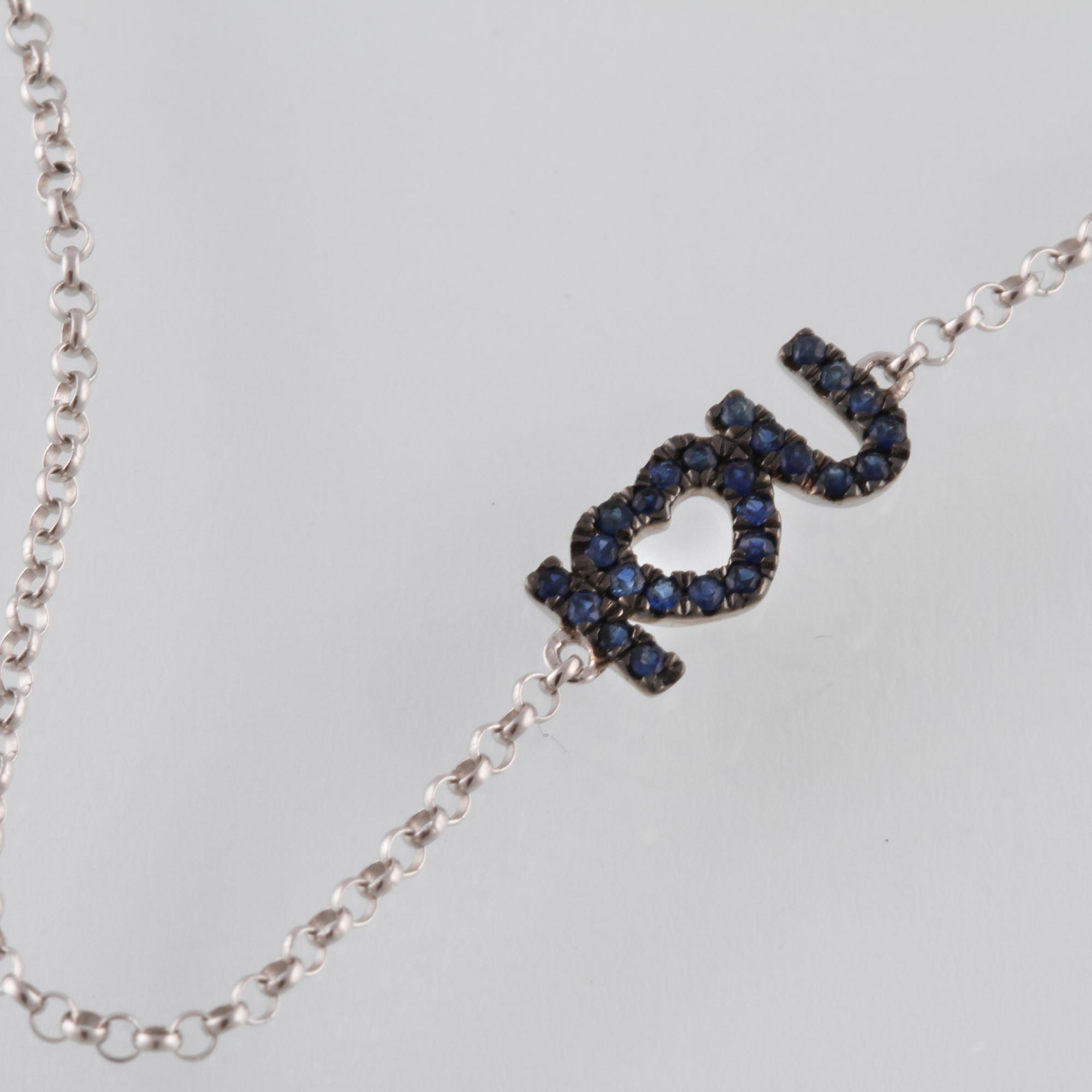 ARMBAND, 18K vitguld med fasettslipade blå safirer. Vikt 1,1 gram.