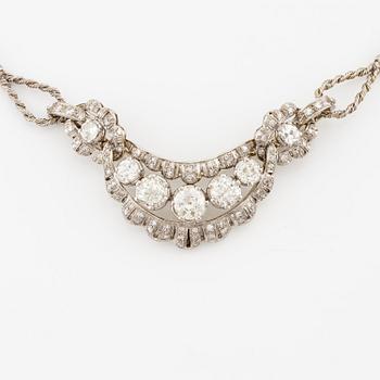 A brooch/necklace combination in 18K white gold set with old- and eight-cut diamonds.