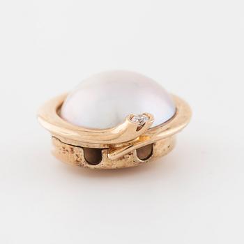 OLE LYNGGAARD, a mabe pearl and brilliant cut diamond clasp.