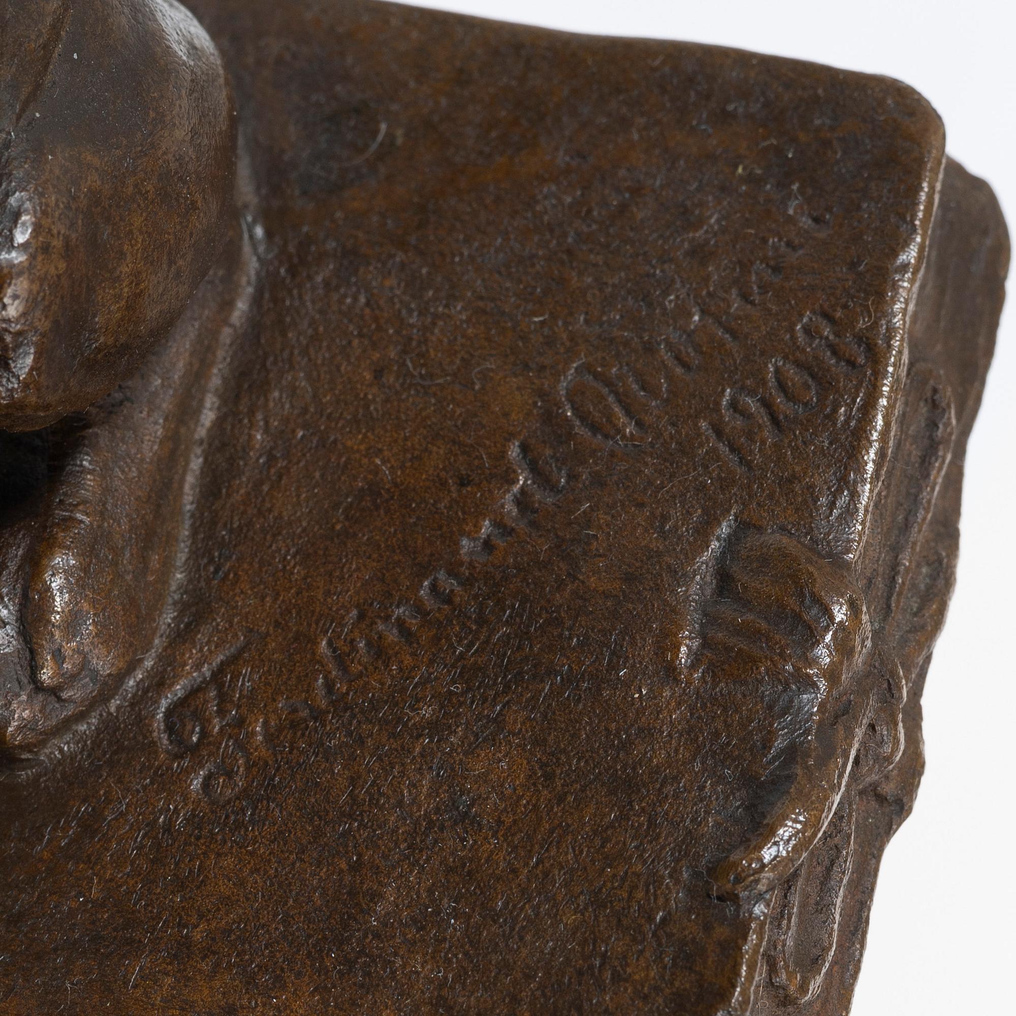 Ferdinand Notini, a bronze sculpture/paper weight, signed, 1908.