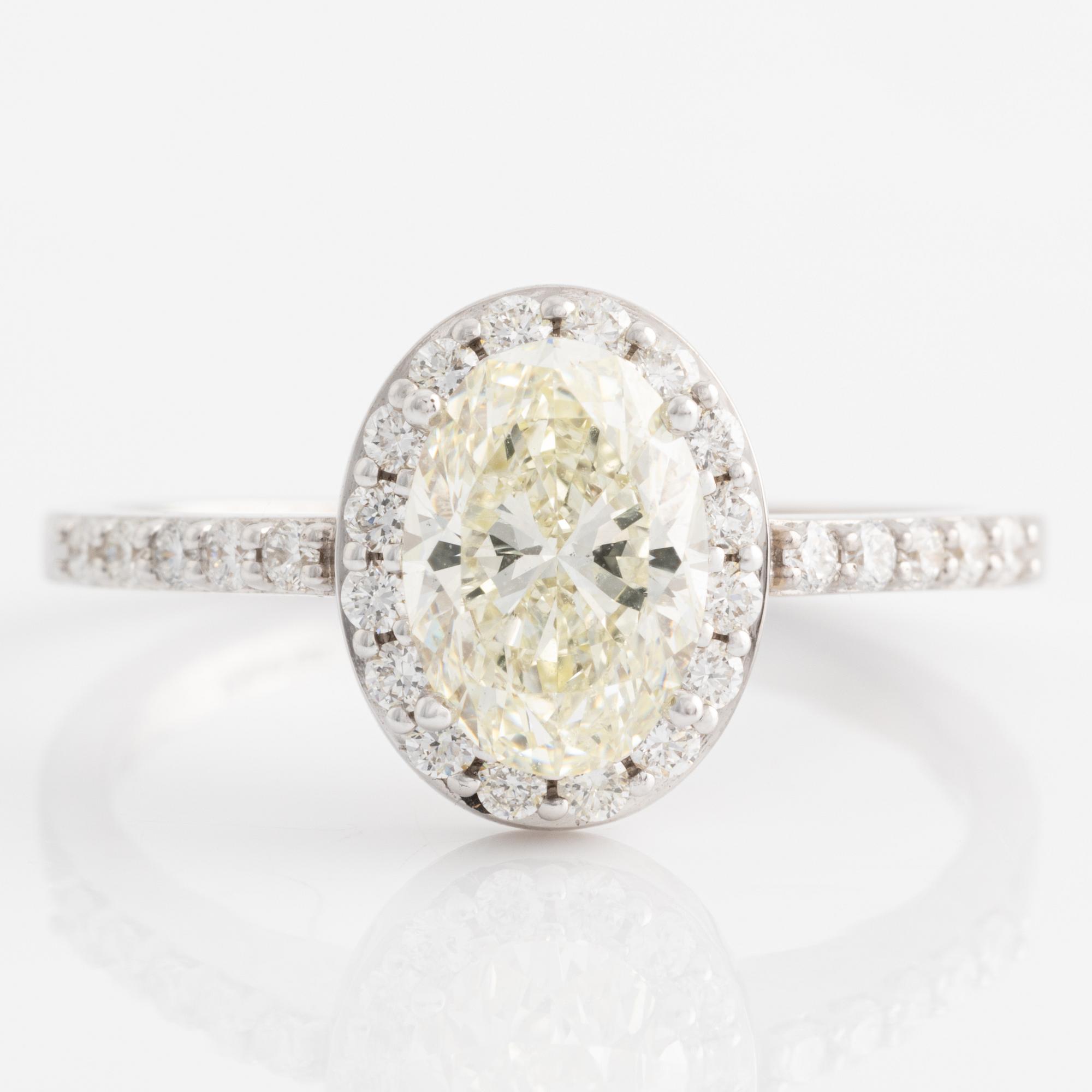 Ring with oval diamond, accompanied by GIA report.