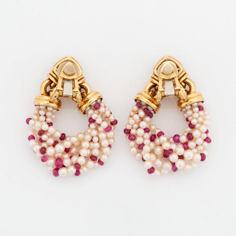 A pair of Bulgari 18K gold earrings with sugarloaf-cut rubelites and cultured pearls and ruby beads.