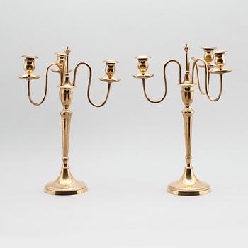 KANDELABRAR, 1 par, mässing, Nils Petter Linderberg, Sundsvall, omkring år 1900.