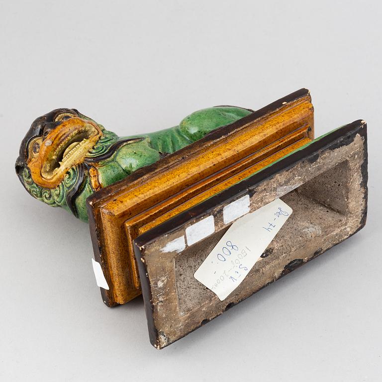 A green and yellow glazed buddhist lion, Qing dynasty, 19th Century.