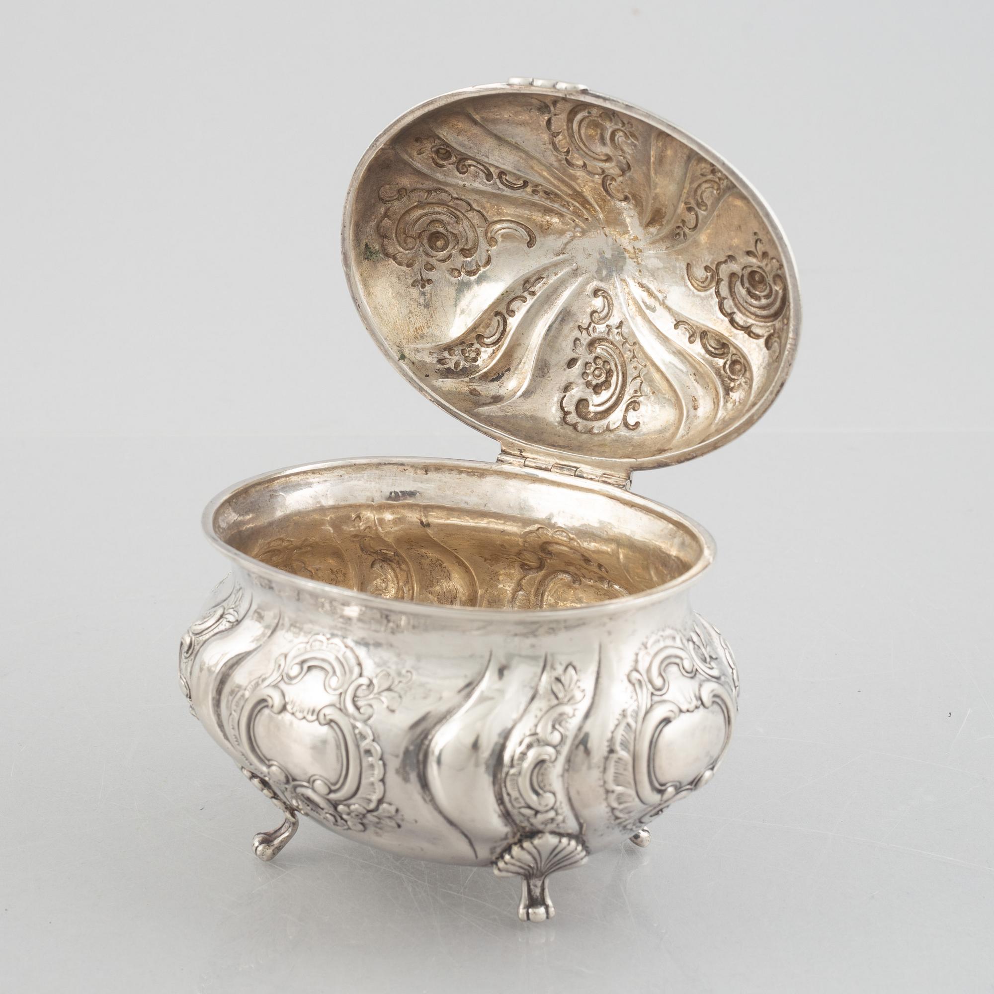 A Rococo-style silver coffee pot, creamer and sugar bowl, 20th Century.