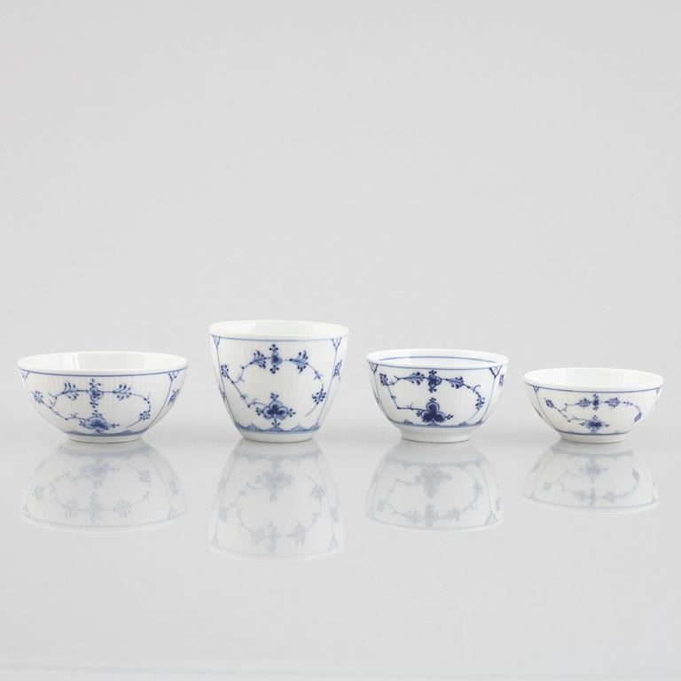 A group of four 'Blue Fluted' / 'Musselmalet rifflet' cups with saucers, Royal Copenhagen, 19th century and later.
