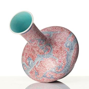 A rare pink and blue enamelled vase with dragons, late Qing dynasty/Republic with an apocryphal Qianlong mark.