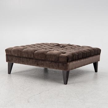 A pouf, contemporary.