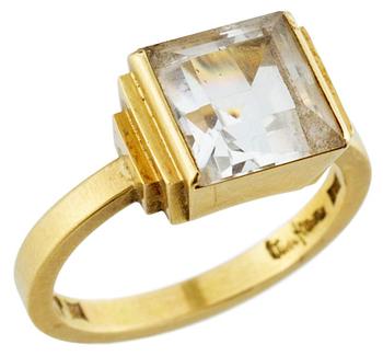 958. A Wiwen Nilsson 18 k gold and a facet cut rock crystal ring, Lund 1969.