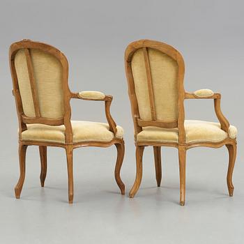 Two matched Louis XV 18th century armchairs.