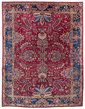 A semi-antique Mashad carpet, northeastern Persia, c. 404 x 307 cm.