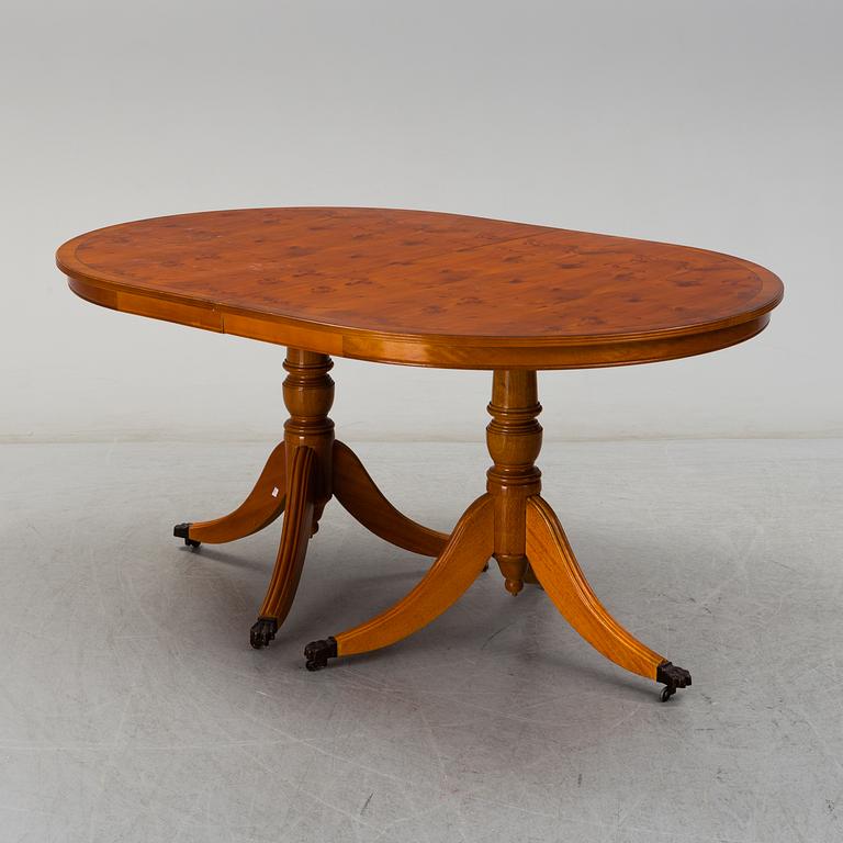 A late 20th century English style dining table and six chairs.