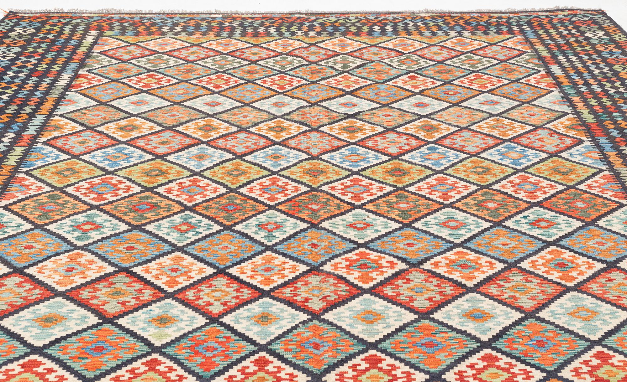 A kilim carpet, circa 396 x 310 cm.