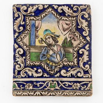 A Persian (Iranian) tile, glazed pottery, Qajar dynasty, 19th century.